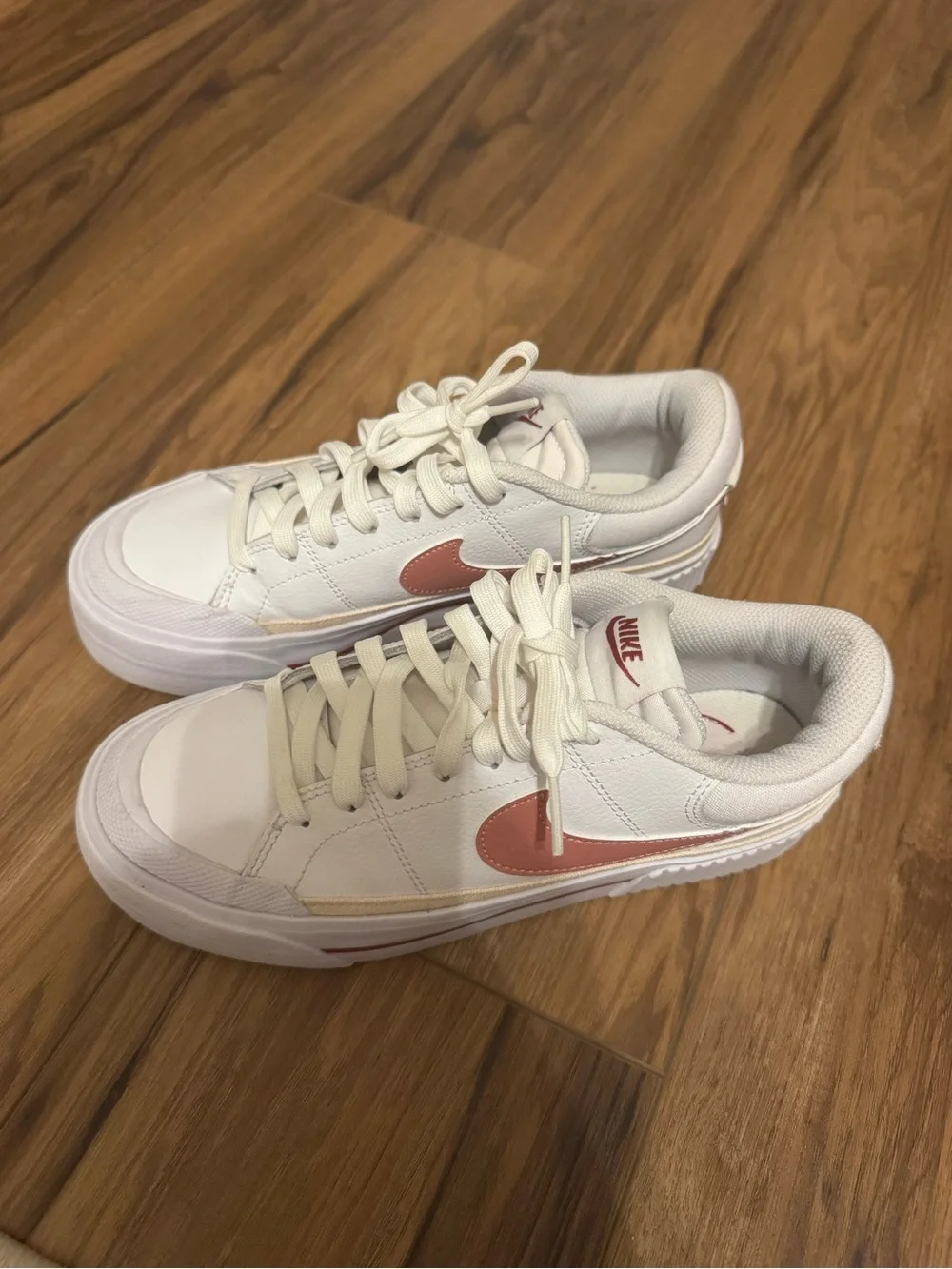 Nike Women’s White Sneakers with Rose Swoosh